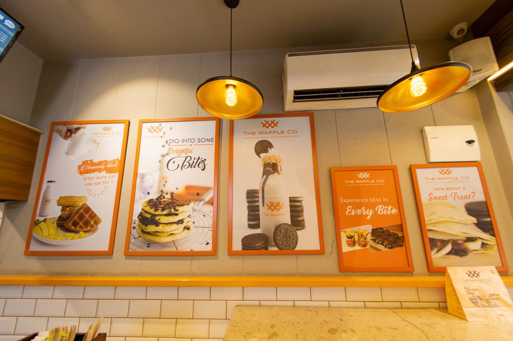 Waffle Franchise Owner Serving Customers