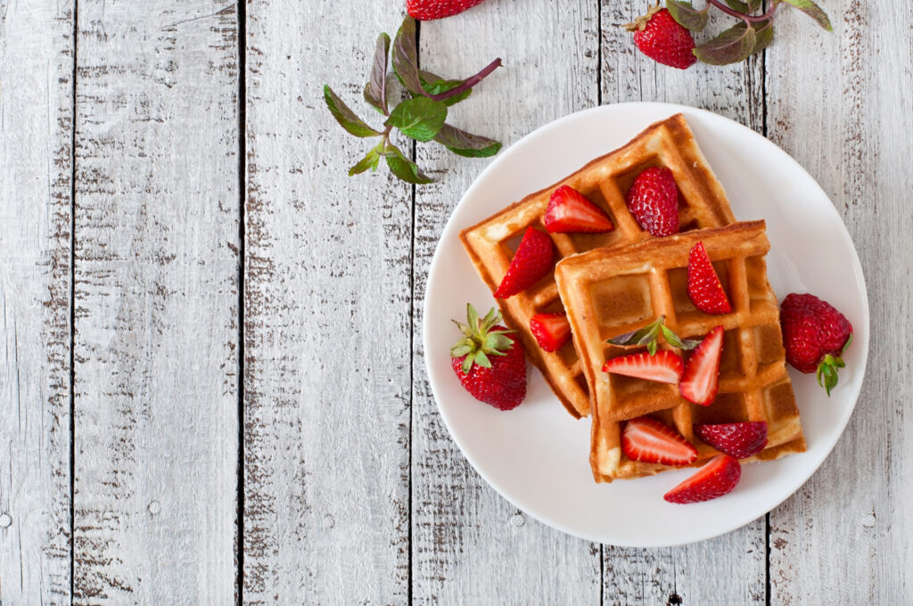 Delicious Waffles with Strawberries and Whipped Cream